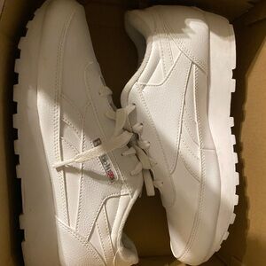 I don’t wear them anymore . Brand is Reebok they are a size 9.5 in women